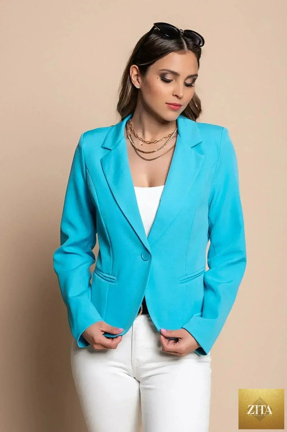 Light blue Femstylo Softina blazer with a tailored fit, featuring classic lapels and sleek design for stylish professional wear.