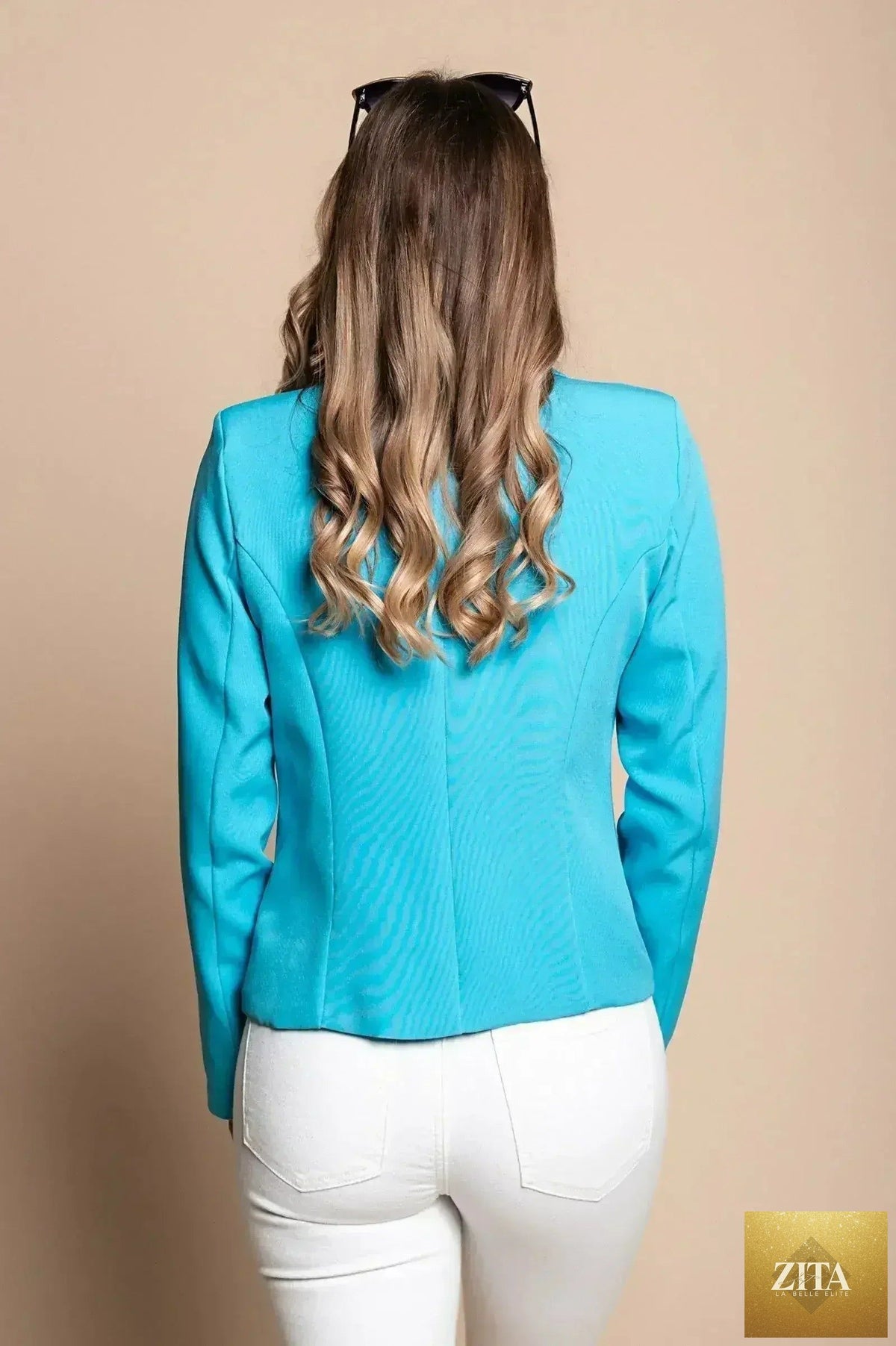 Light blue Softina blazer by Femstylo, Italian tailored fit, shown on a model highlighting the sleek, fitted design and smooth fabric.