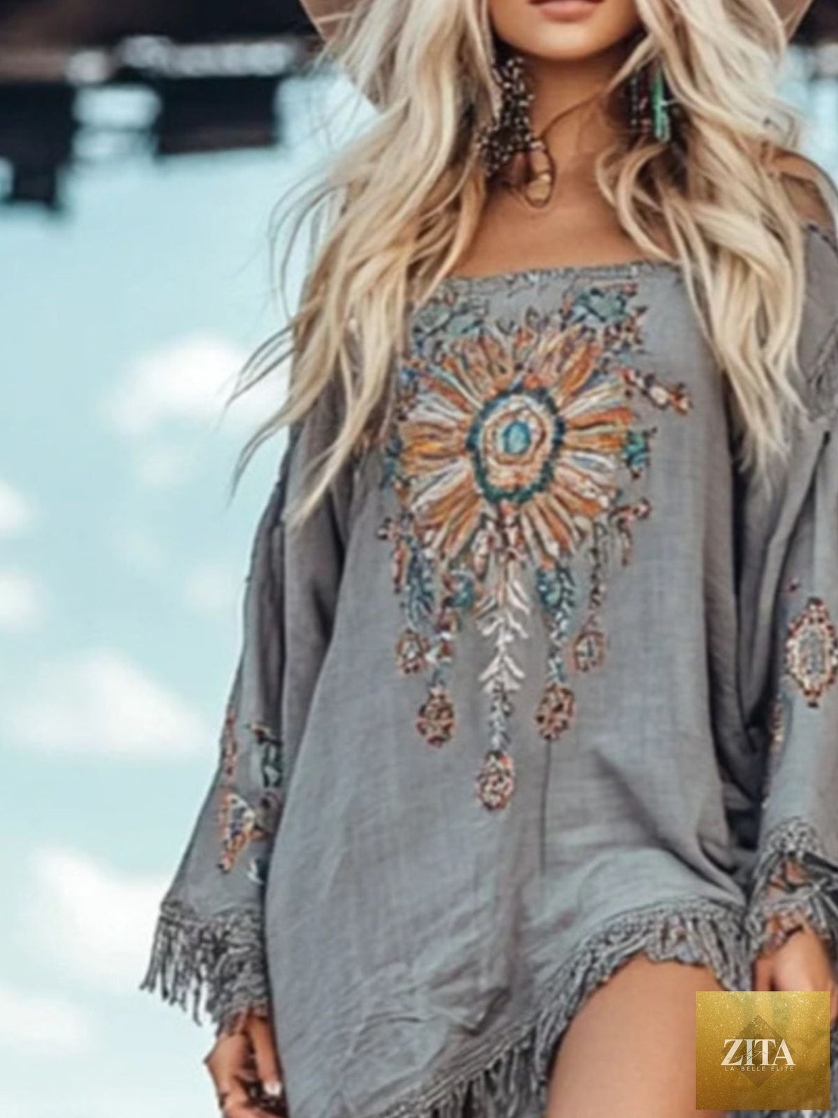 Shopiebay fringe hem long sleeve mini dress featuring a stylish design and flowing fringe details on the hem.