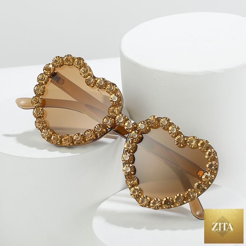 Peach heart-shaped rhinestone sunglasses by FitiqueFit featuring Y2K style trendy eyewear with sparkling embellishments.