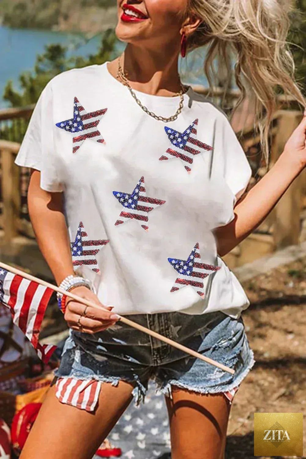 Black sequined American flag star graphic T-shirt by Femstylo, featuring bold star and flag design with shimmering sequins.