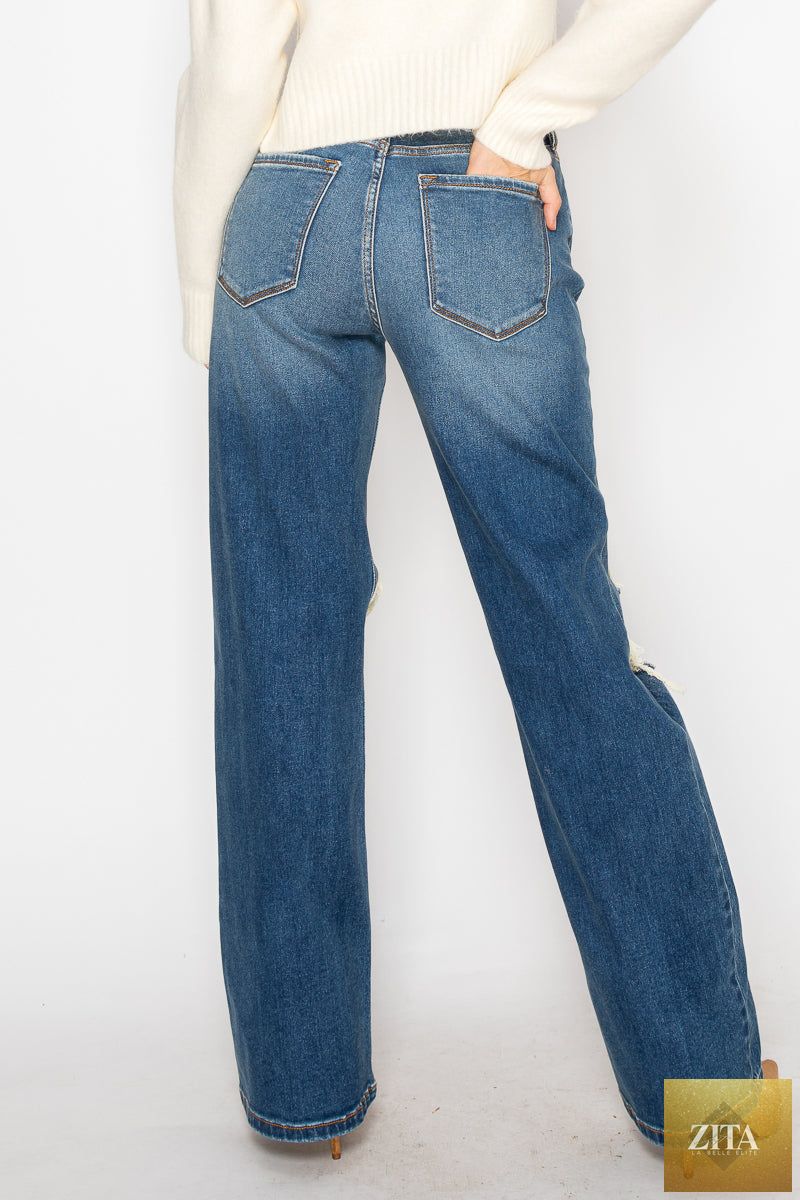 Artemis Vintage hybrid stretch ripped flare jeans with distressed details and a fitted waist on a model.