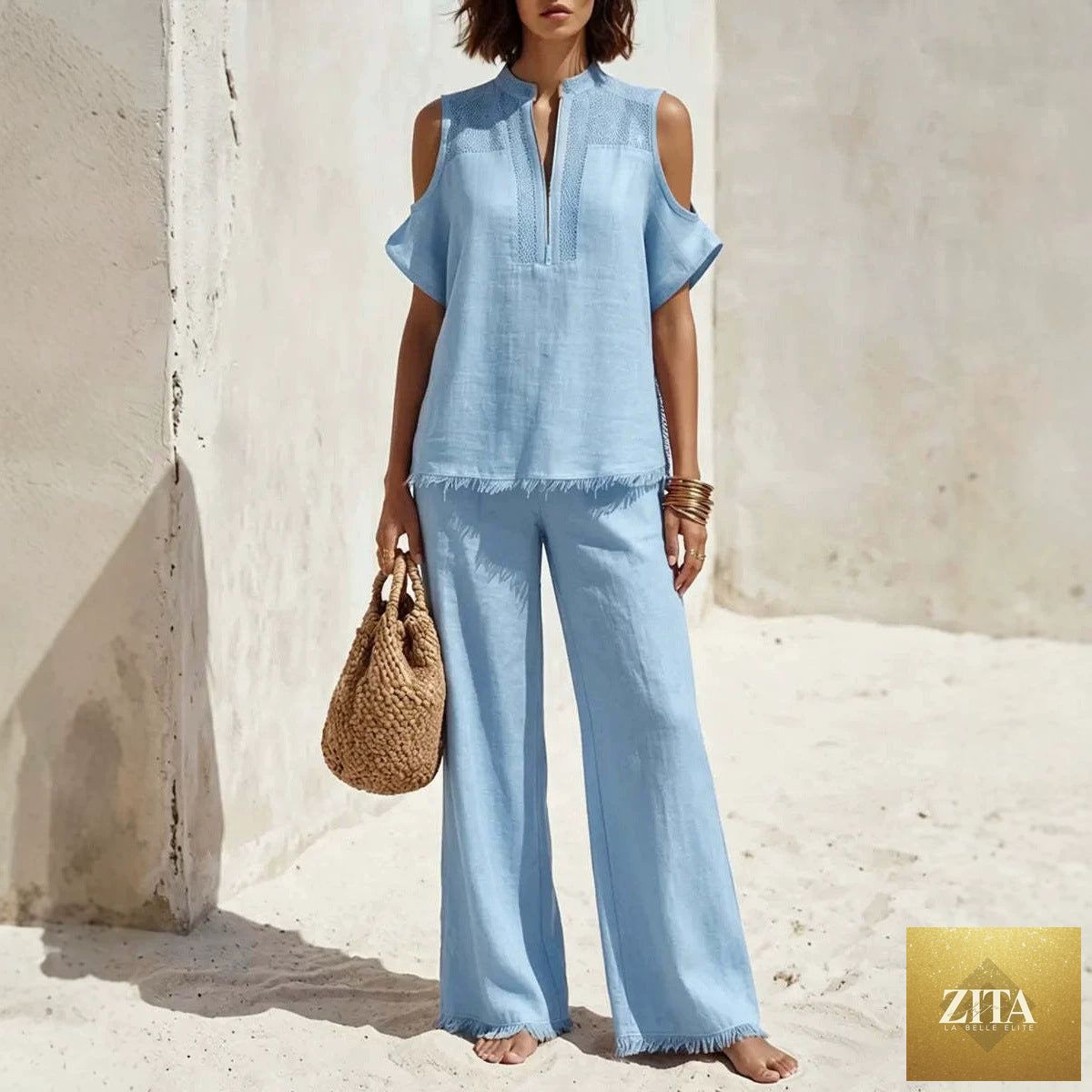 Women's off-shoulder linen blend pantsuit set by Zita La Belle Elite, featuring short sleeves and a stylish two-piece design.