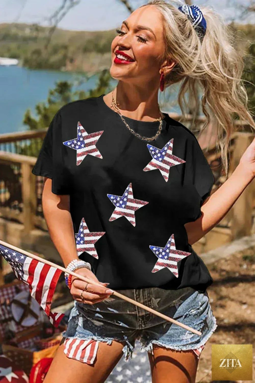 Black sequined American flag star graphic T-shirt by Femstylo featuring bold star design and patriotic style.