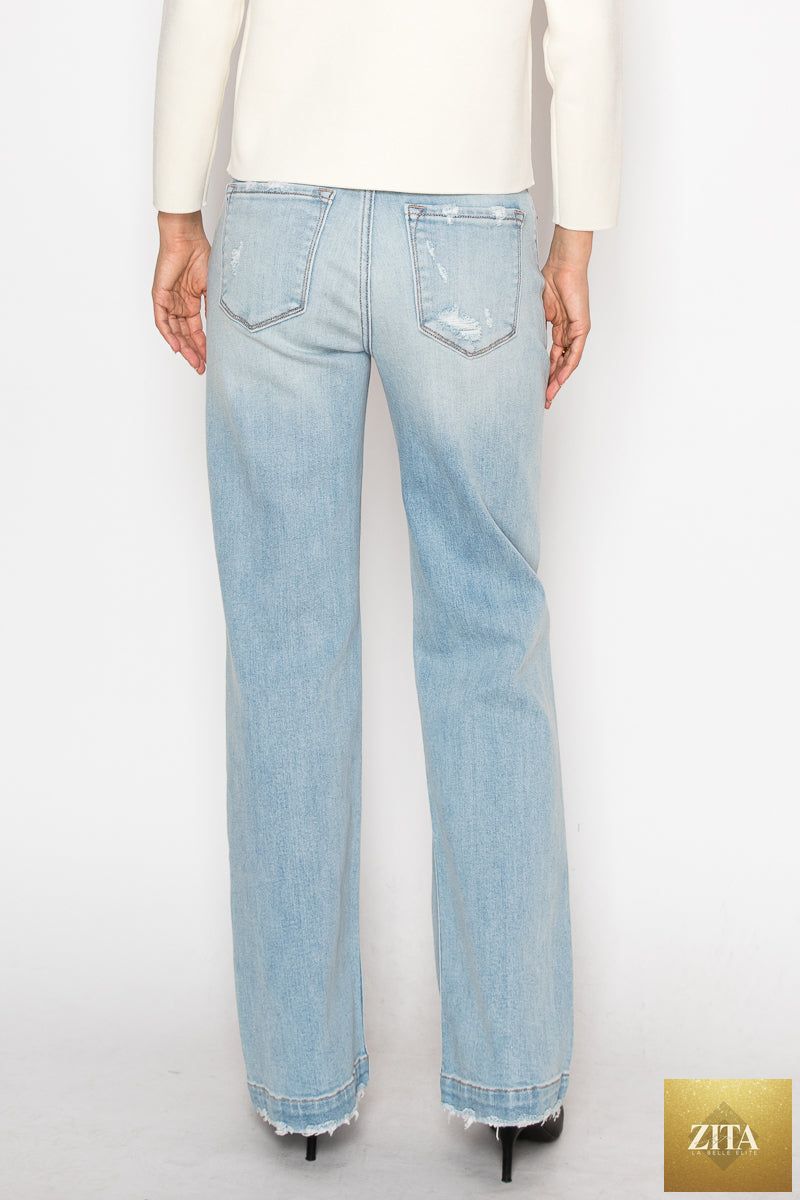 Artemis Vintage high-rise relaxed straight leg jeans with tummy control, in classic denim, shown on a model.