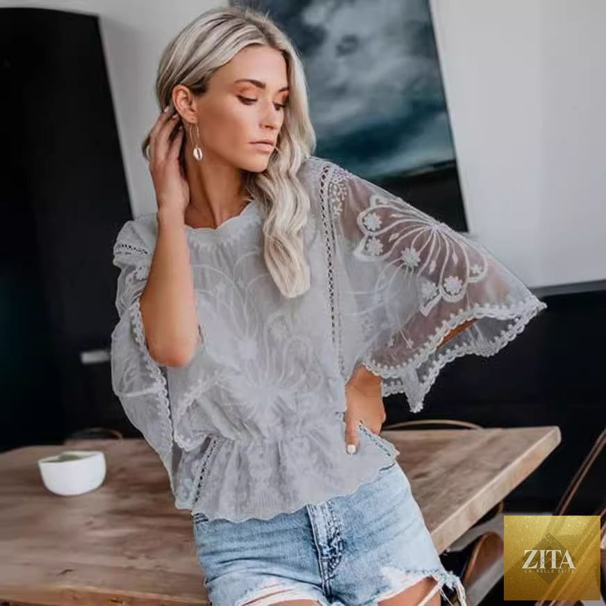 Women's casual lace trim short sleeve batwing top by FitiqueFit, featuring delicate lace details and relaxed fit.