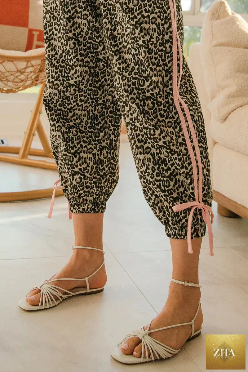 Blu Lotus Boutique leopard print bottoms with side line details and drawstrings, featuring a stylish and comfortable design.