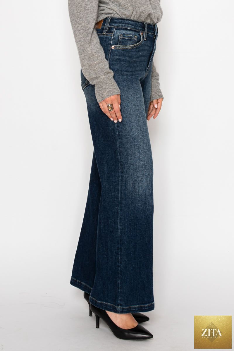 Artemis Vintage hybrid stretch ripped ultra high rise relaxed flare jeans with distressed detailing and wide-leg fit.