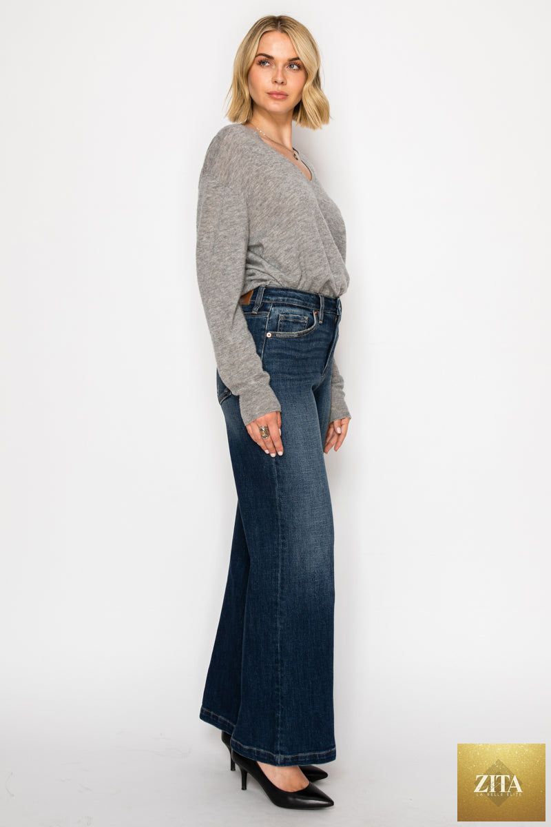 Artemis Vintage hybrid stretch ripped ultra high rise relaxed flare jeans with distressed details and frayed hems.