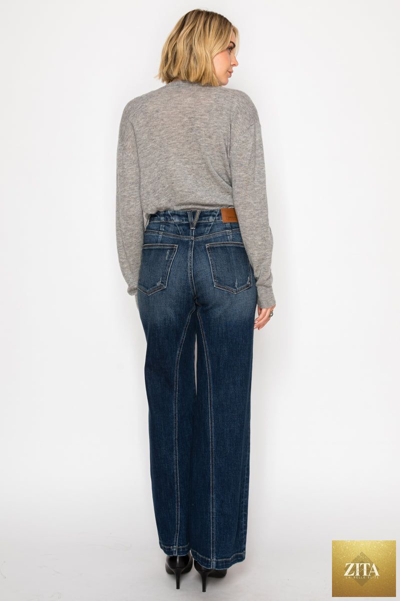 Artemis Vintage hybrid stretch ripped ultra high rise relaxed flare jeans displayed on a hanger with distressed details and faded wash.