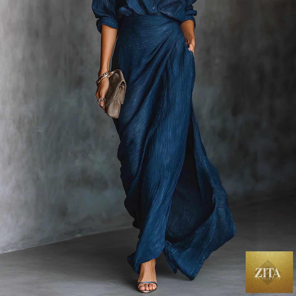 Women’s two-piece pleated shirt and wrap maxi skirt set by FitiqueFit, featuring a long sleeve button shirt and flowing skirt.
