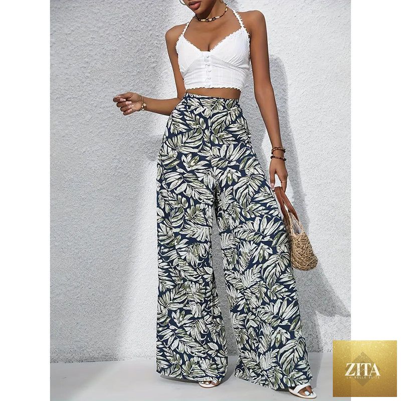 Women’s printed high-waist wide-leg palazzo pants from FitiqueFit, casualwear with colorful floral print and flowing wide-leg design.