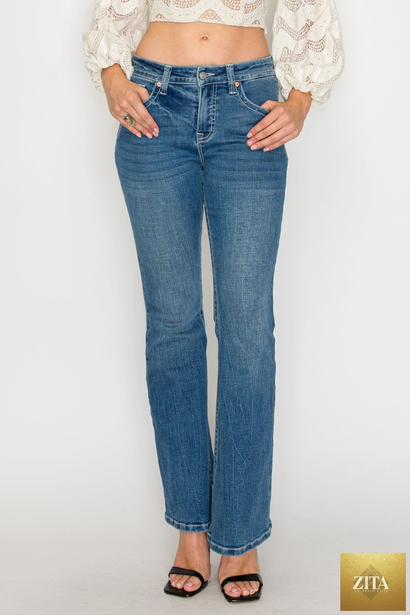 Medium wash Stevie Tummy Control high-rise slim flare jeans by Artemis Vintage displayed on a model.