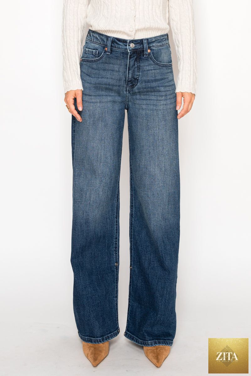 Artemis Vintage high-rise jeans with tummy control and A-wide leg fit, showcasing dark denim fabric and stylish stitching.