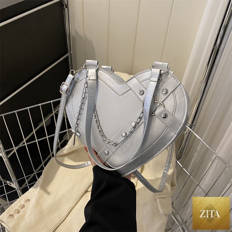 Korean-style cute heart-shaped shoulder crossbody bag by Social Buzz eSIMs featuring a charming niche design and adjustable strap.