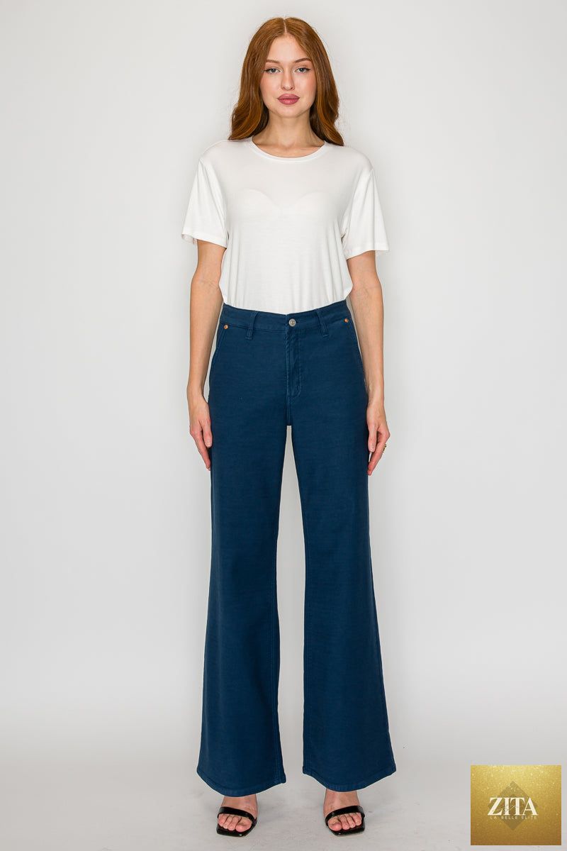 Anastasia high-rise wide flare jeans by Artemis Vintage, showing fit and style details on light denim fabric.