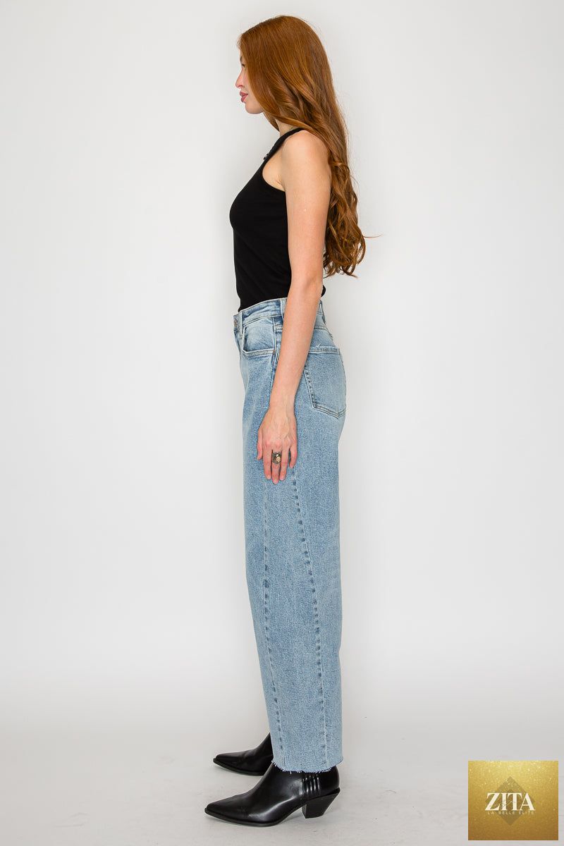 Blue Harlow high-waisted barrel jeans by Artemis Vintage, showing the relaxed fit and classic denim texture.