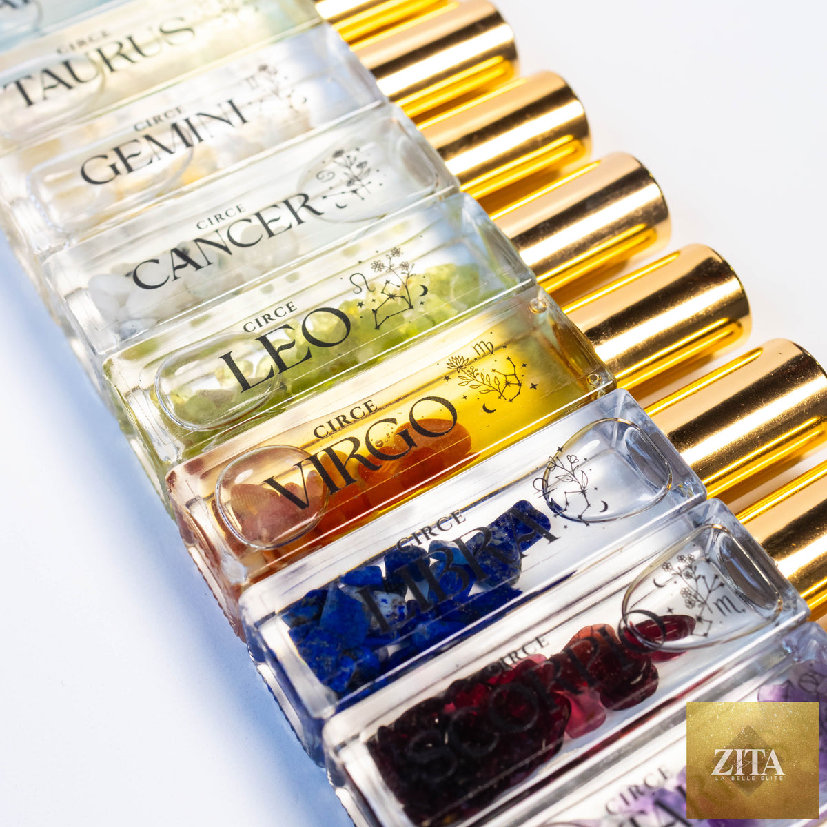 Zita La Belle Elite Zodiac Perfume Oil Set with 12 gemstone-infused scents, featuring small glass bottles with colorful labels.