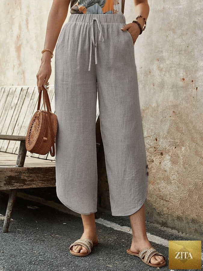 Women's cotton-linen cropped drawstring pants by FitiqueFit, casualwear with relaxed fit and adjustable waistband.