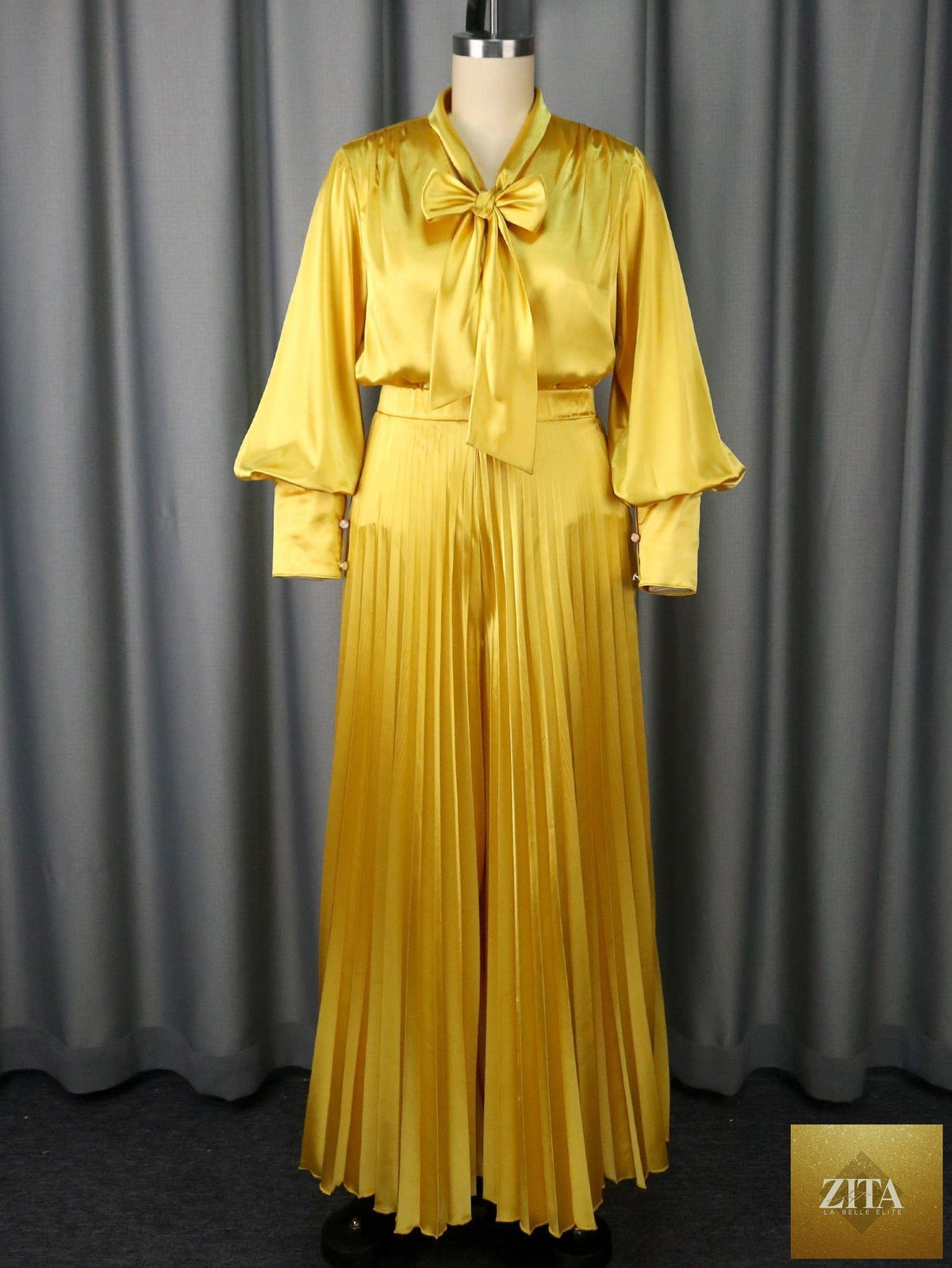 Elegant pleated wide-leg trousers suit featuring a sexy V-neck bow long sleeve top, stylish and sophisticated for women.