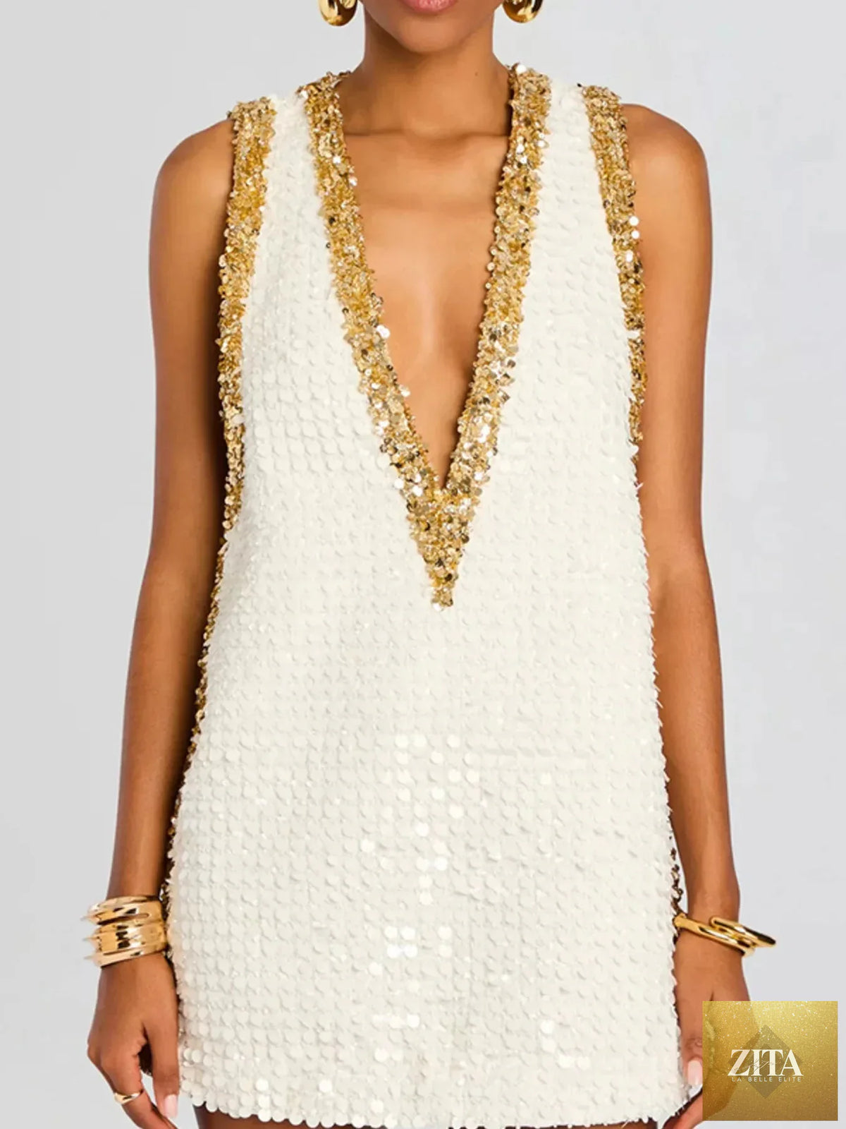 Sequin embellished sleeveless mini dress by Shopiebay, featuring glittering sequins and a fitted sleeveless design for stylish occasions.