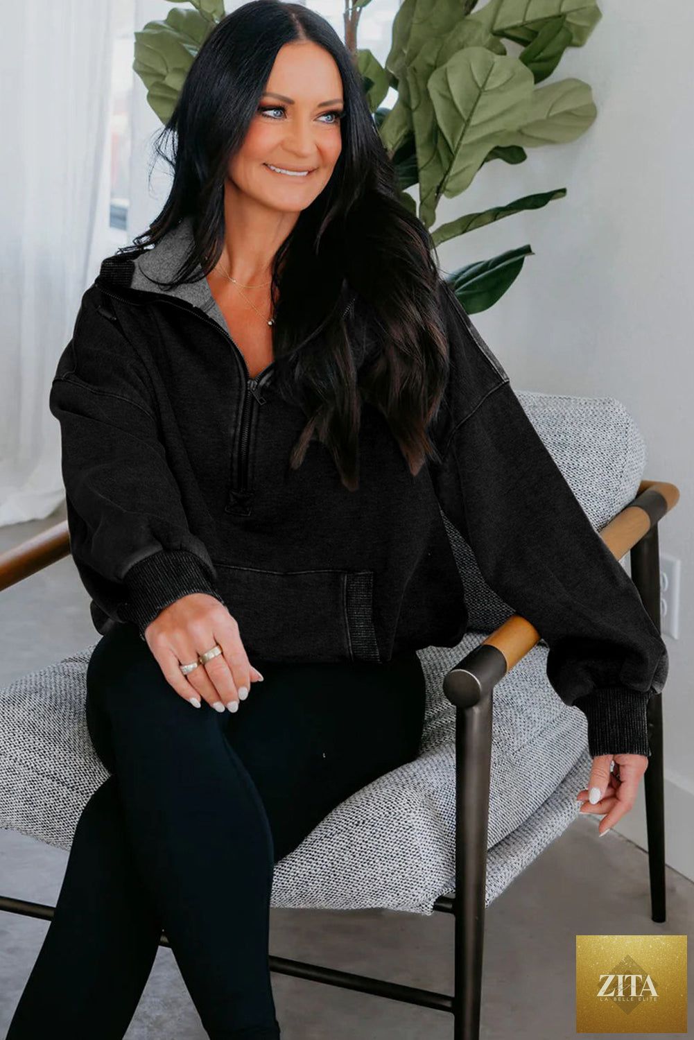 Black half zip kangaroo pocket mineral wash hoodie from Wild and Free Boutique, showing a relaxed fit and soft fabric.