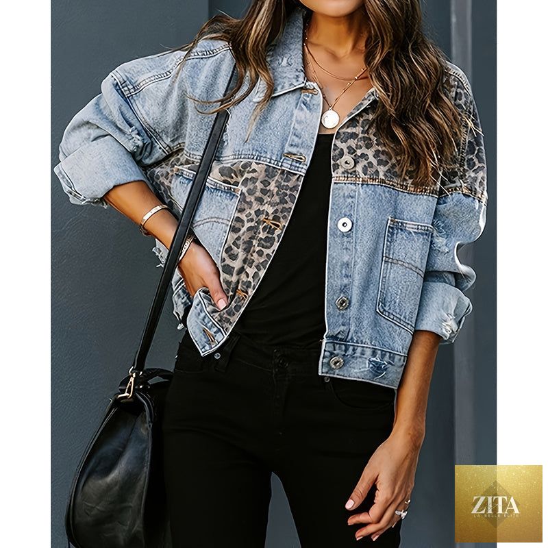 Women's distressed cropped denim jacket by FitiqueFit, casualwear style with frayed edges and classic blue denim fabric.