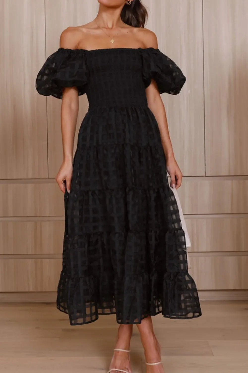 Off shoulder short puff sleeve midi dress by Shopiebay, featuring a stylish, feminine design with a fitted waist and flowing skirt.