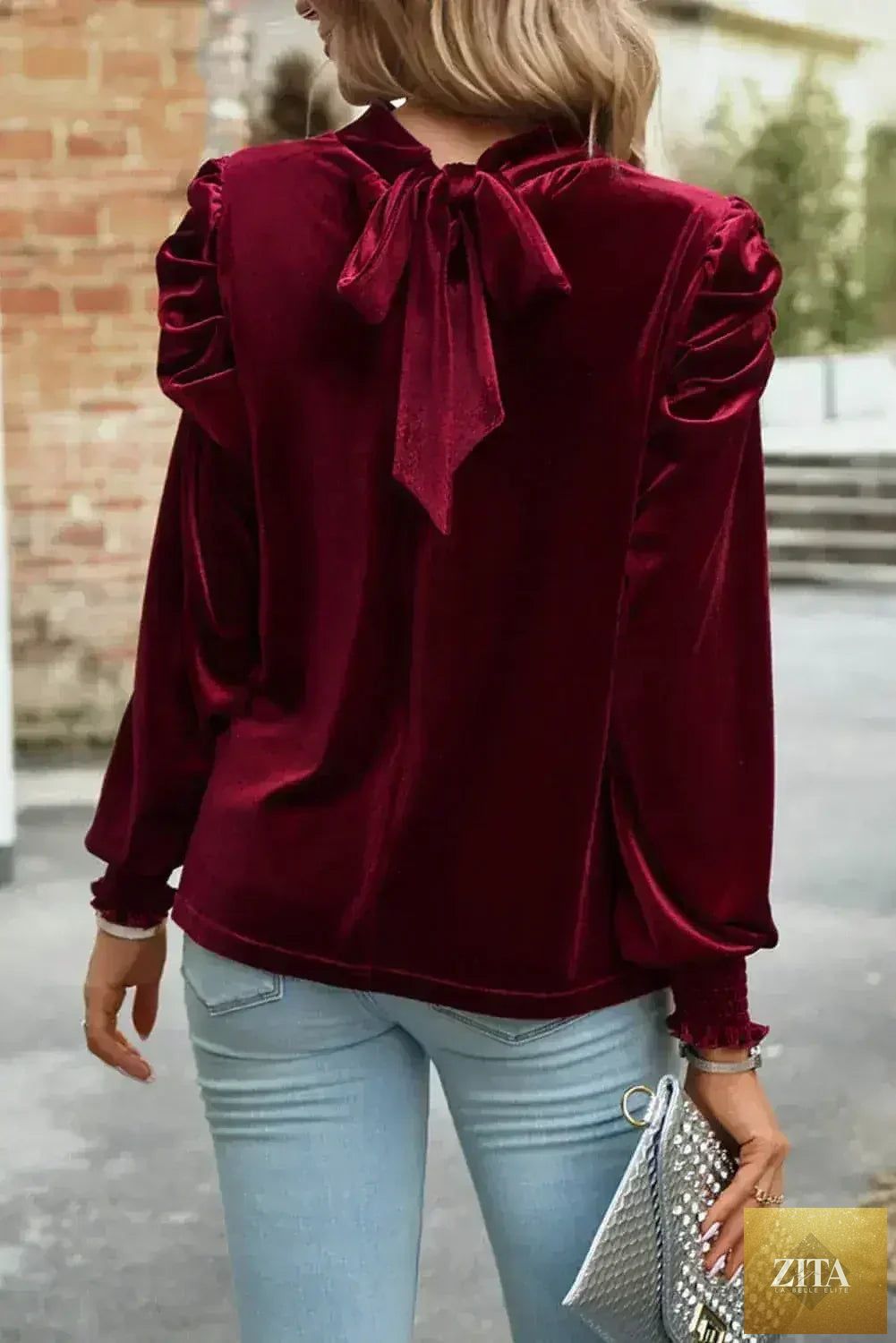 Fiery red velvet blouse by Femstylo with mock neck and puff sleeves, styled as a trendy women's top or blouse.