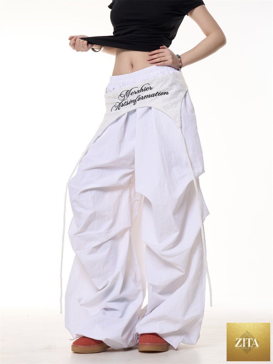 Relaxed women's casual American-style layered cargo pants with tie details, featuring functional pockets and comfortable fit.