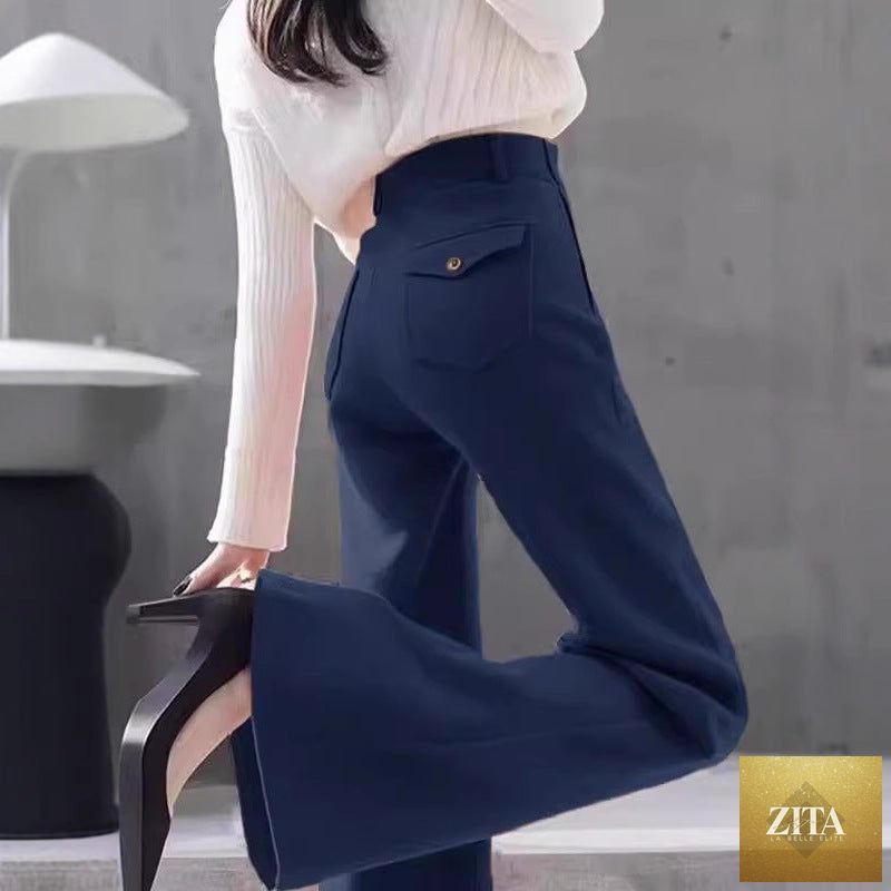 High-waisted slimming workwear bootcut pants by My Store displayed on a hanger, showcasing their sleek fit and versatile style.