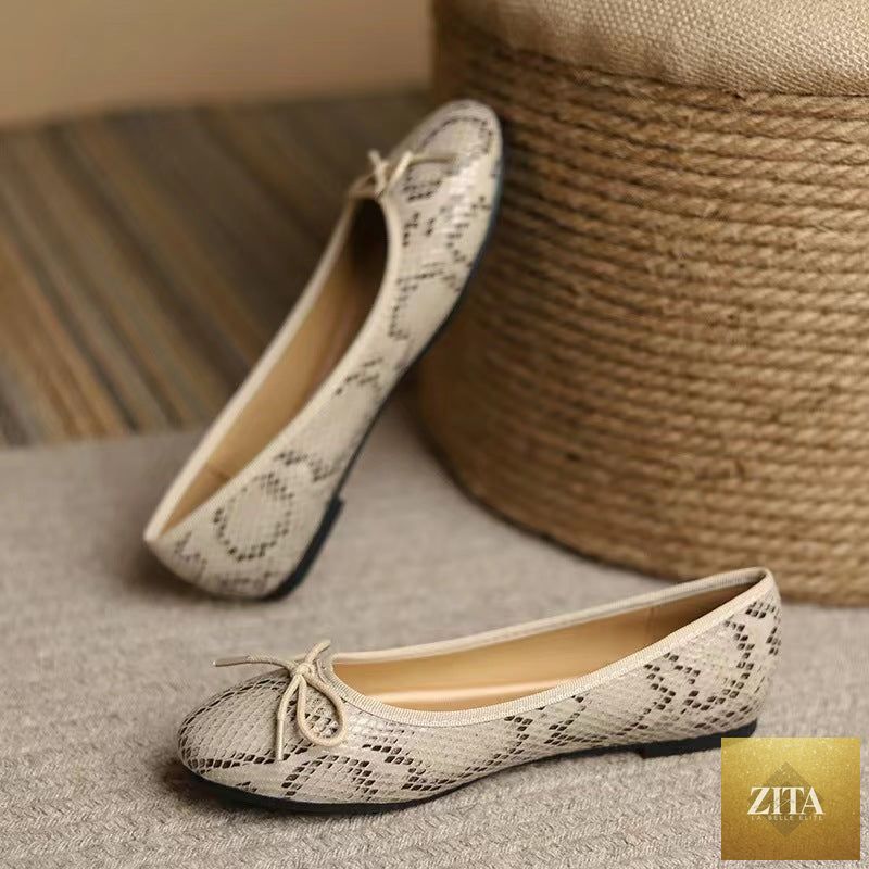 Women's slip-on flats with egg-roll edge, round toe design, modeled in neutral color, inspired by Chanel-style pumps by FitiqueFit.