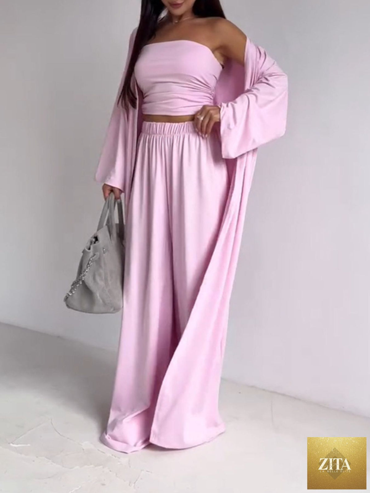 Wild and Free Boutique three-piece set with a tube top, cardigan, and pants, stylish and coordinated for casual wear.