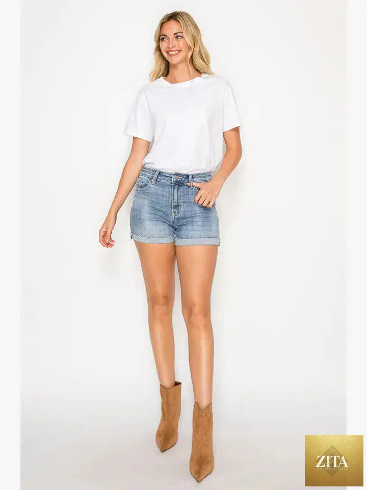 Kathy high-rise cuffed stretch shorts by Artemis Vintage, showing the cuffed hem and fitted waist in a casual denim style.