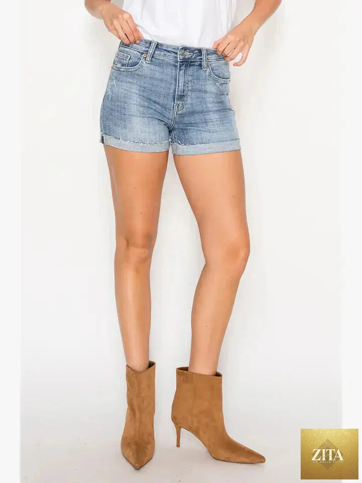 Artemis Vintage Kathy high-rise cuffed stretch shorts in denim, featuring rolled cuffs and a fitted waist.