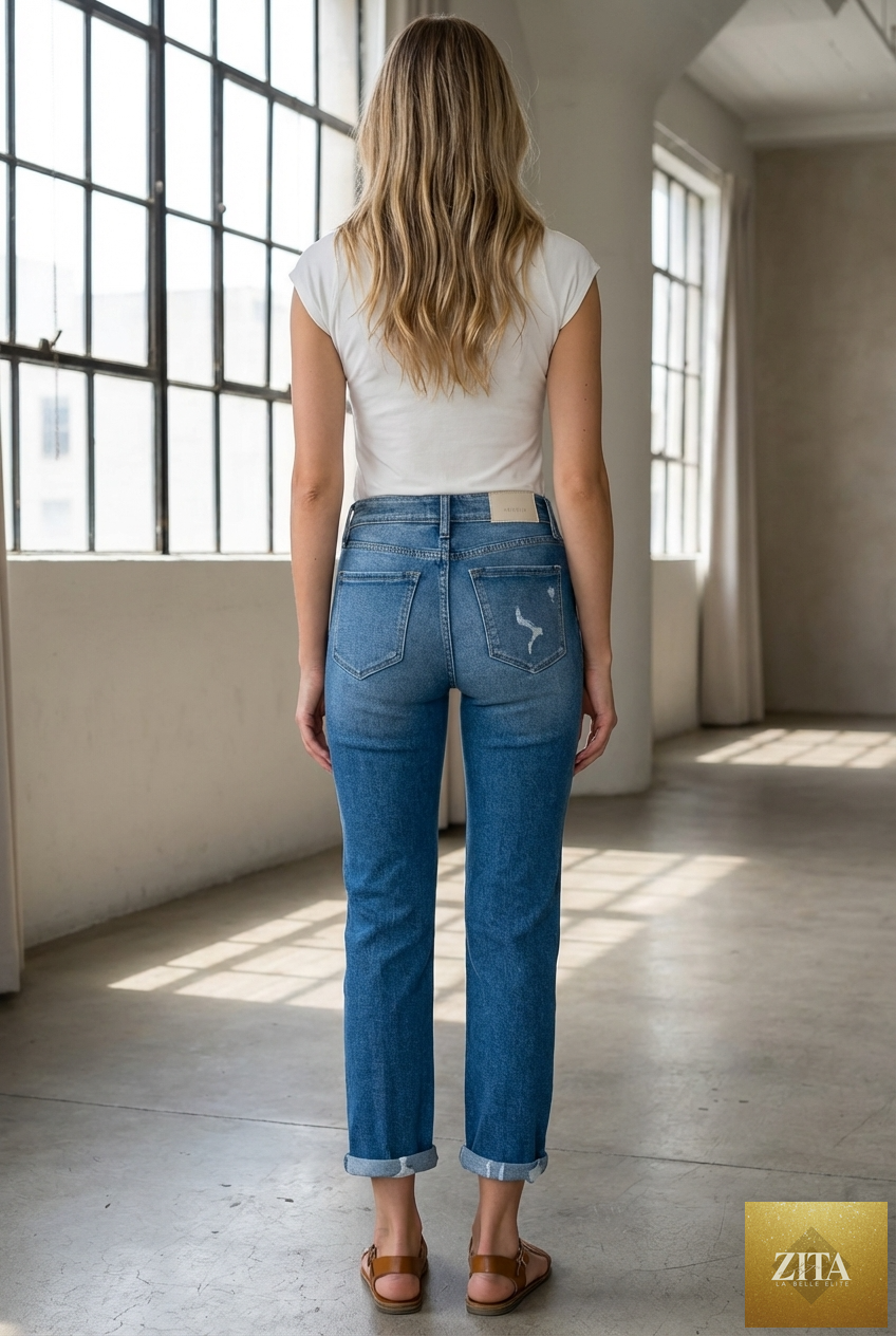 Artemis Vintage Alexa high rise tapered leg mom jeans showing classic blue denim with front pockets and a relaxed fit.