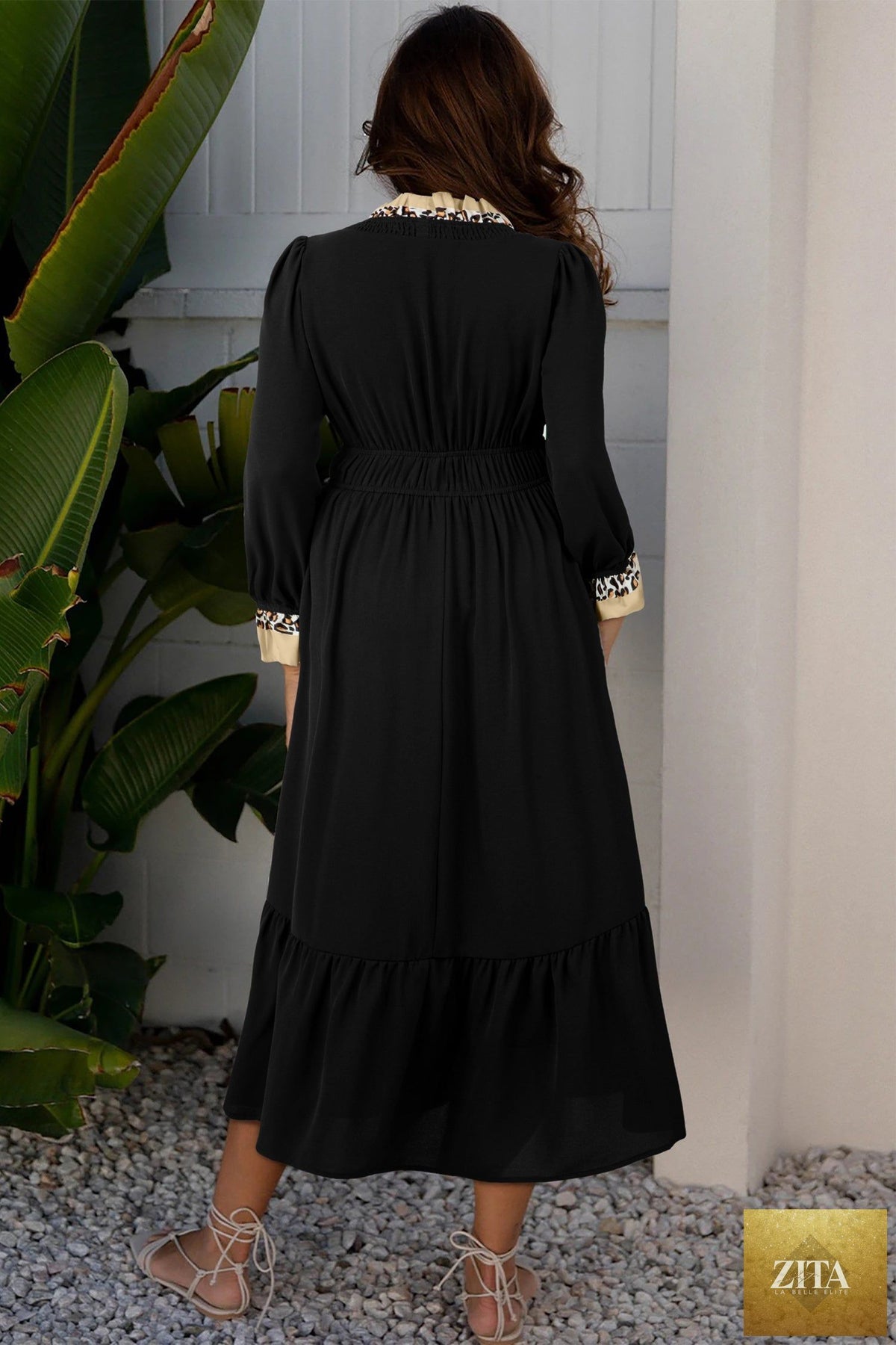 Black contrast leopard print midi dress with frilled trim, V-neck, bracelet sleeves, from Wild and Free Boutique.