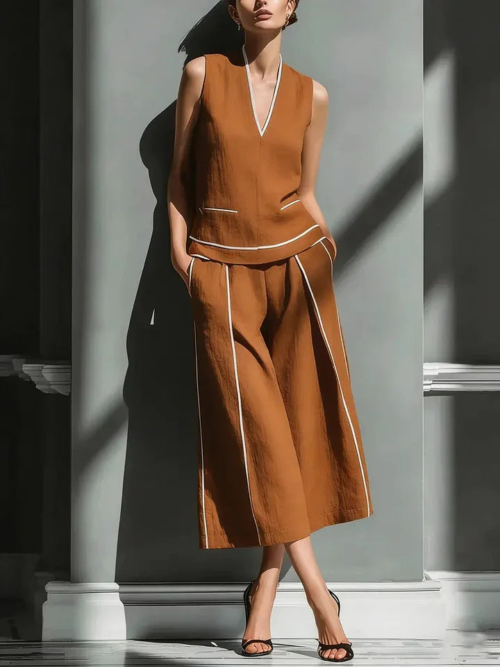 Women's sleeveless linen shirt and cropped pants set by FitiqueFit, casual linen outfit perfect for warm weather.