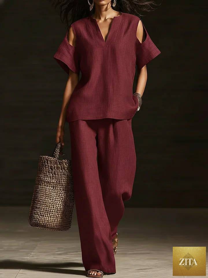 Zita La Belle Elite two-piece V-neck short sleeve top and straight-leg pants set with ripped details and pockets in solid color.