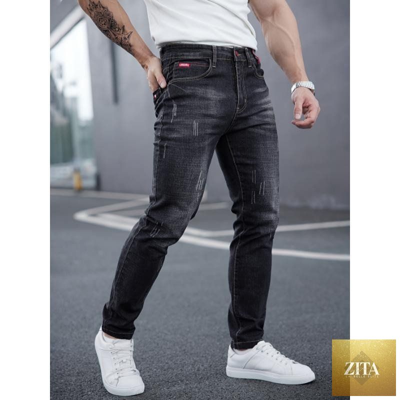 Mandotos men's ripped denim jeans with cat-whisker scratches, showing distressed fabric and stylish, casual fit.