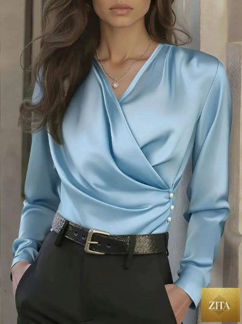 Women's elegant cross V-neck blouse by FitiqueFit featuring ruffle details and button accents, perfect for casual or office wear.