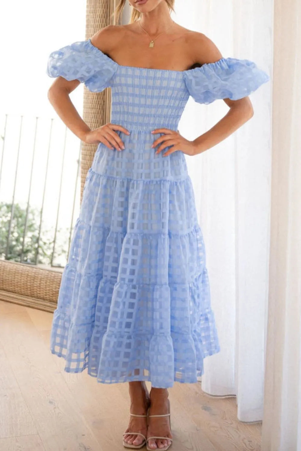 Off shoulder short puff sleeve midi dress by Shopiebay, featuring a fitted bodice and flowy skirt in a stylish design.