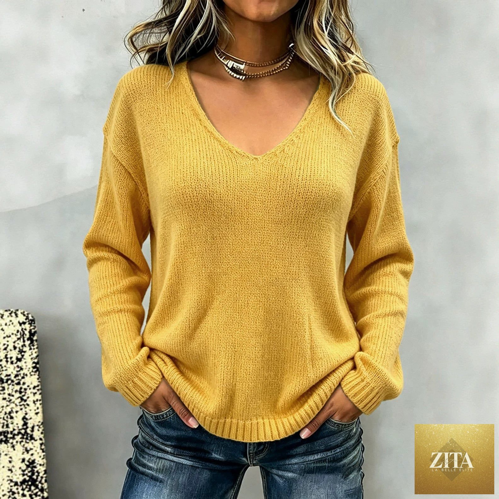 Women's relaxed fit V-neck drop-shoulder sweater by FitiqueFit, shown in soft knit fabric with a casual, cozy style.