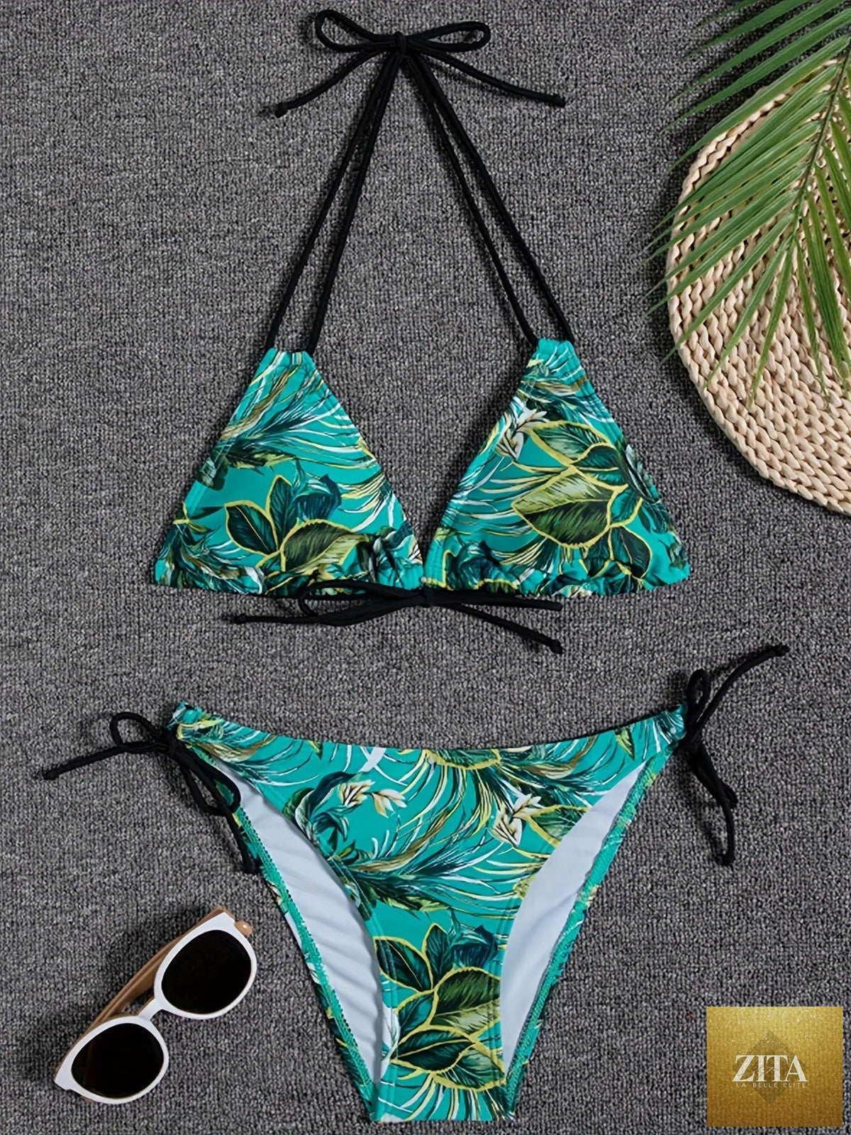 Stevvex Sunset Bloom 2-piece triangle bikini set for women with vibrant floral print, halter neck, tie-back, and high-cut bottoms.