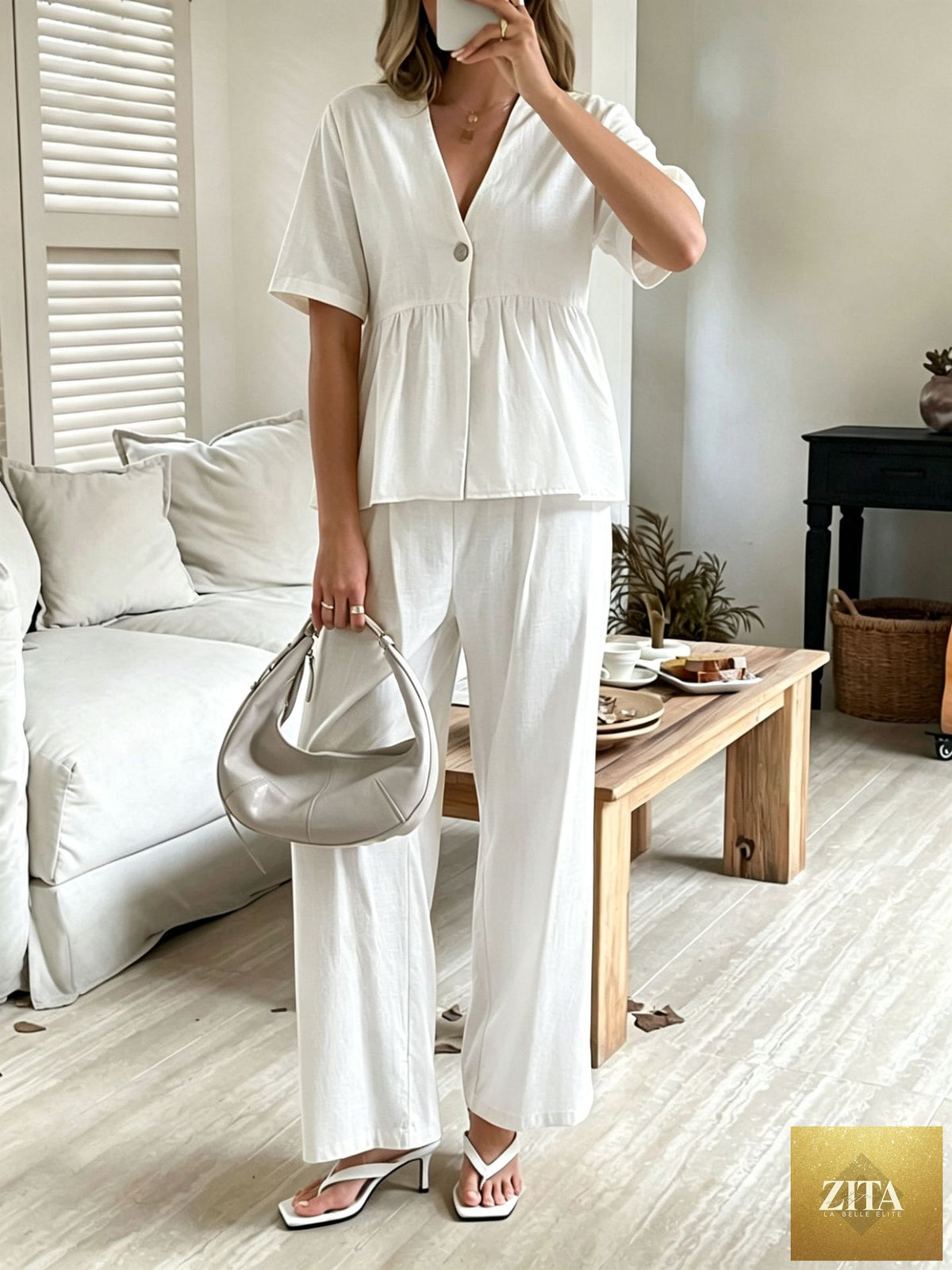 Women's V-neck casual top and wide-leg pants set by Zita La Belle Elite, featuring a relaxed fit with short sleeves and comfortable fabric.