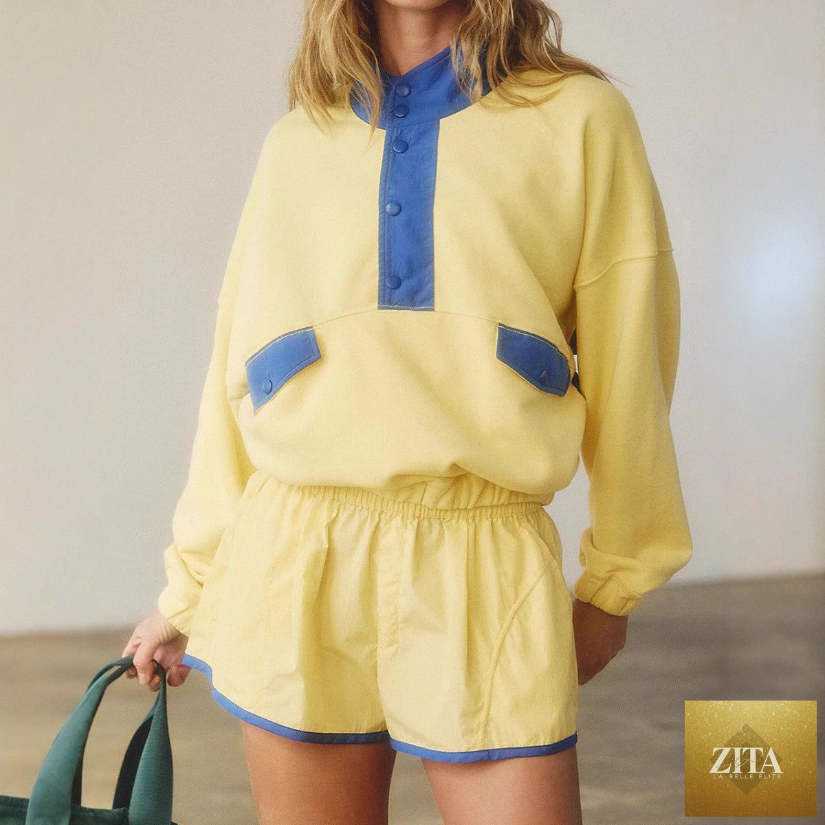 Women's long-sleeve contrast color 2-piece casualwear set with top and cropped pants by FitiqueFit, shown on a model.