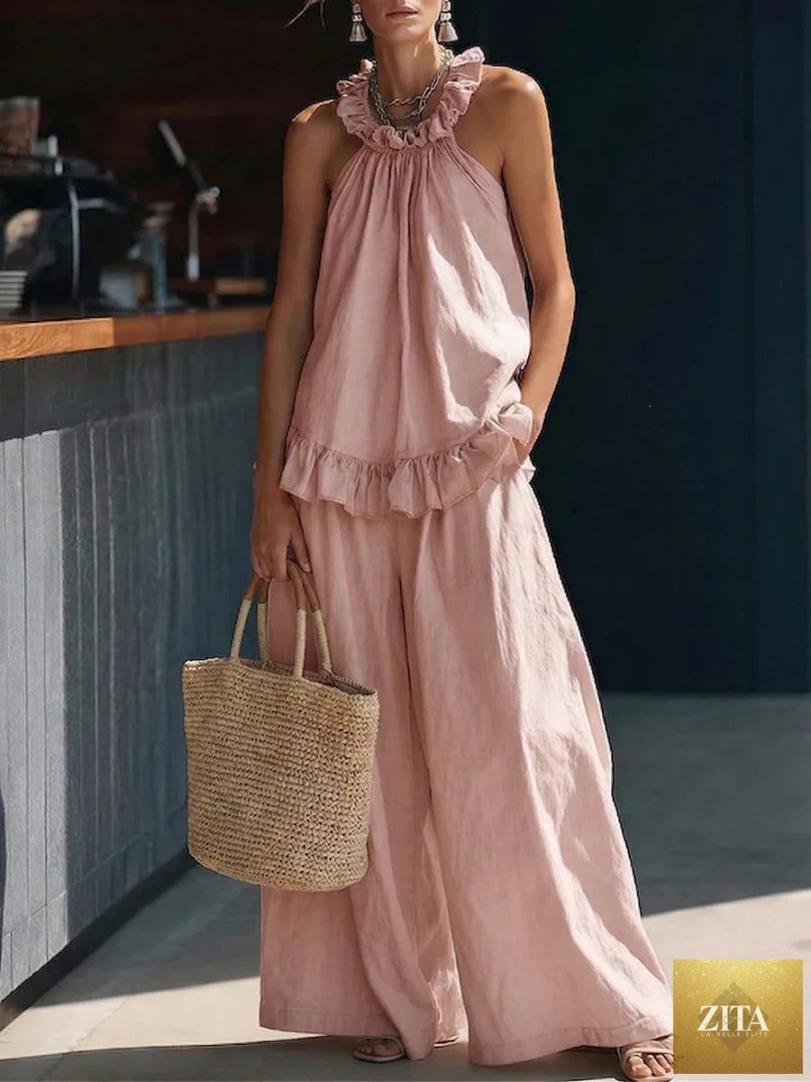 Zita La Belle Elite halterneck loose two-piece casualwear set with pleated top and asymmetric pocket pants displayed on a model.