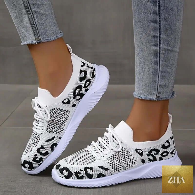 White women's sneakers by SnagBag featuring leopard print lace-up design and sporty style suitable for casual wear
