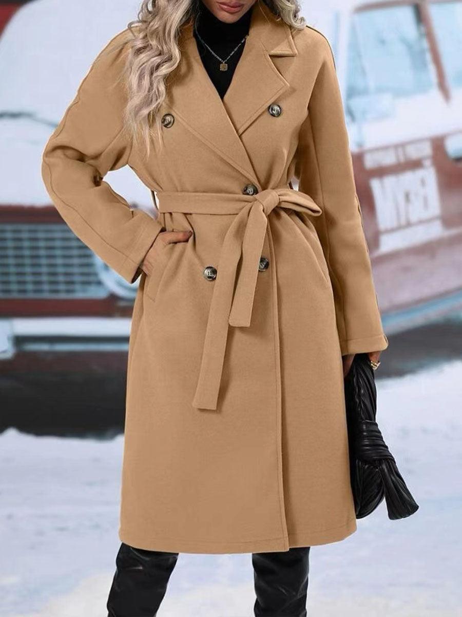 Women’s winter coat by Stevvex, long wool-blend trench with lapel collar, double-breasted design, belt, and solid color outwear.