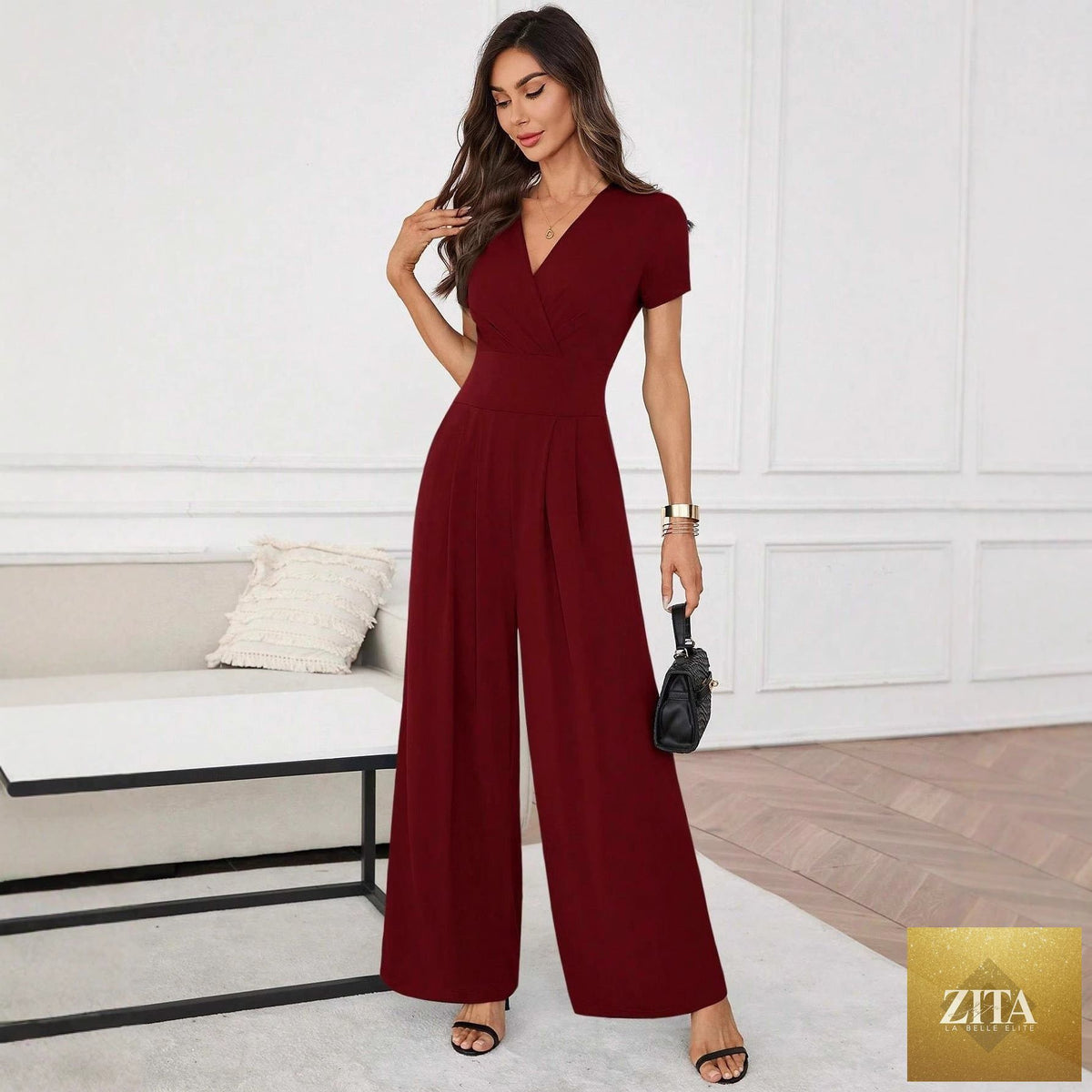 Three-quarter sleeve pleated wide-leg jumpsuit by FitiqueFit in two colors, featuring a stylish, flowing design and comfortable fit.